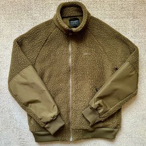 Filson men’s army green fleece zip-up jacket.